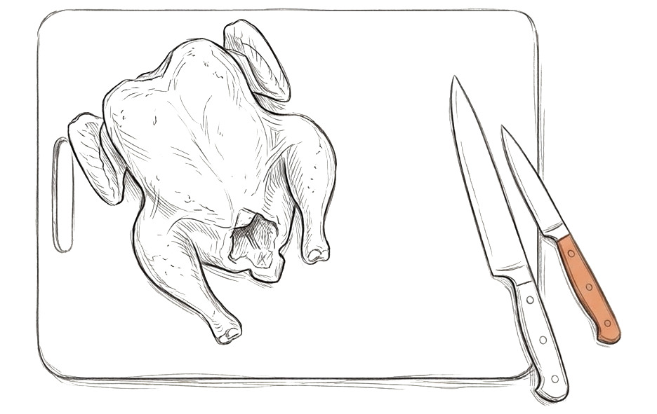 A raw chicken on a chopping board with knives